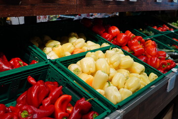 Bell and capia pepper varieties in crates for sale at supermarket
