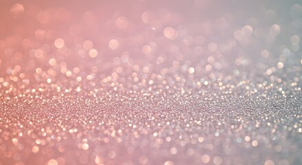 A softfocus image shows a textured surface of sparkling glitter in shades of pink and blue