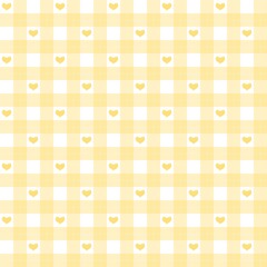 Gingham soft yellow heart plaid pattern background. Cute heart checkered tartan pattern. Romantic seamless plaid with hearts. Seamless patterns with soft yellow hearts on checkered design.