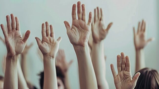 Group of diverse hands raised up, symbolizing collective participation, voting, agreement, and asking questions. - Powered by Adobe