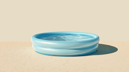 A blue inflatable kids' pool filled with water placed on a bright terrace under direct sunlight.