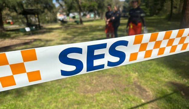 Sydney, NSW, Australia - August 12 2025 :  SES tape. Temporary barrier or warning tape: used by State Emergency Service (SES) to block access to unsafe premises.