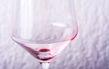 Empty Red Wine Glass with Residue Minimal Still Life on White Surface