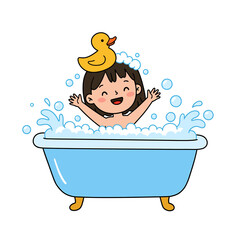 Happy little girl enjoys a bubble bath in a blue tub with a cute yellow rubber duck toy on her head. Fun childhood hygiene routine concept