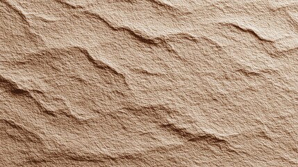 a close up view of a textured surface resembling sand or soil. the upper part of the image features undulating lines that suggest wavy patterns, possibly mimicking water ripples or sand dunes