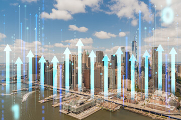 Manhattan skyline with holographic arrows and binary code overlay. Double exposure with light, daytime background. Future technology and business concept. Double exposure