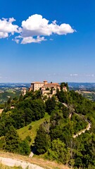 Naklejka premium Ancient castle nestled in lush hills