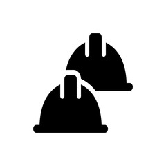 Two black construction helmets stacked slightly offset providing safety and protection for workers on site