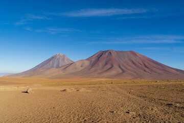 Juriques and Licancabur volcanoes, seen from the border crossing between Chile and Bolivia.