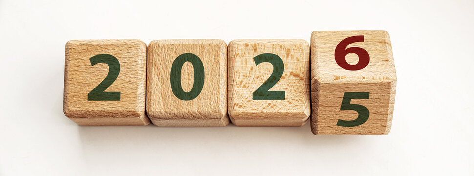 Wooden blocks display years 2025 and 2026, symbolizing end of one year and start of another, inspiring thoughts of change and new opportunities for growth.