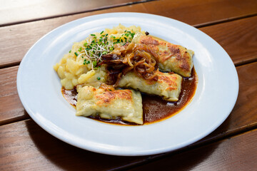 Maultaschen German Meat Filled Dumplings or Pasta with Gravy Sauce and Potato Salad