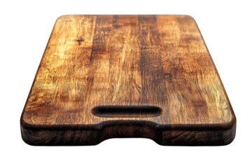 Wooden cutting board with handle groove, warm brown tones, isolated on black