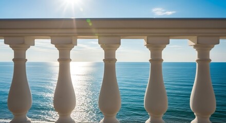 Balustrade overlooking the sea on a sunny day, creating a serene view.