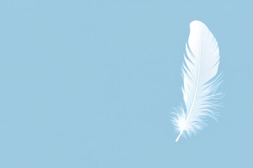 Naklejka premium White feather floating on a light blue background, representing lightness, purity, and softness