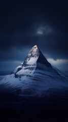 Snow-Capped Mountain Under Stormy Skies