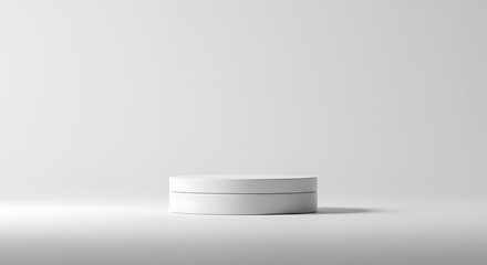White cylinder pedestal on a clean studio background for product presentation. Minimalist 3D rendered stage for advertising