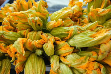 Fresh yellow-orange zucchini blossoms