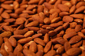 Almonds roasted in paprika spices. Close-up. Background for snacks and nuts
