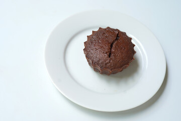 Lava chocolate cake on a plate on white background