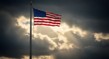 Veterans Day. National holiday of the USA. Soldier of USA. American flag waving proudly against a dramatic cloudy sky.