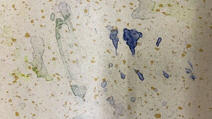 Abstract watercolor dribbles on parchment evoke ethereal echoes of Festivus and Holi, merging chaos with serene harmony