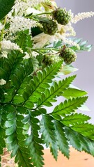 Green fern and budding berries entwine with creamy astilbe, conjuring Midsummer folklore, forest whispers, and nature's poetry