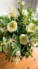 Ivory roses and lush ferns entangle in ornate symphony, whispering tales of Beltane's renewal and Victorian romance