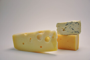 Cheese assortment close-up. Different types of cheese isolated on white.