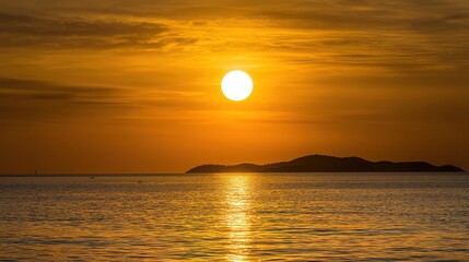 Golden sunrise over calm sea, glowing horizon under large copy space sky, cinematic mood creates warm serene atmosphere ideal for travel, nature or relaxation themes.