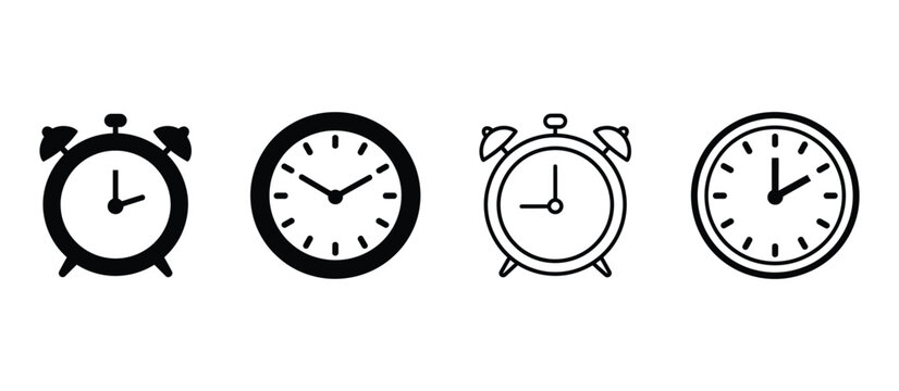 Collection of four vintage alarm clocks in black and white showing different times