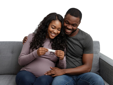 Joyful African American Couple Embracing Good News of Positive Pregnancy Test on Sofa