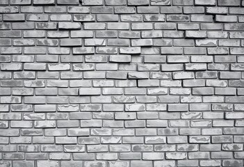Obraz premium Abstract grayscale texture of a weathered brick wall, backdrop, stone