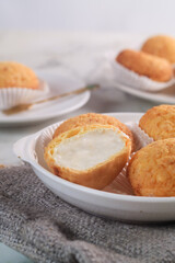 A French cream puff crack bun (Choux au Craquelin) filled with diplomat cream. It's a dessert base of savory choux dough bun
