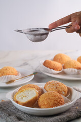 A French cream puff crack bun (Choux au Craquelin) filled with diplomat cream. It's a dessert base of savory choux dough bun
