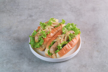hot dog with ketchup and mustard on a plate
