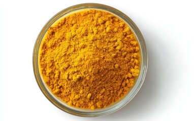Bright yellow spice powder in small glass bowl