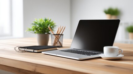 Modern Home Office Setup with Laptop, Coffee, and Plants on a Wooden Desk
