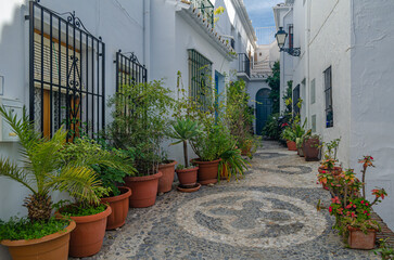 Streets in Frigiliana, typical Andalusian village with white houses, Spain