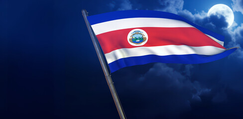 Costa Rican Flag in Night Sky: A striking image showcasing the vibrant Costa Rican flag waving against the backdrop of a moonlit, cloudy night sky, celebrating national pride and unity. 