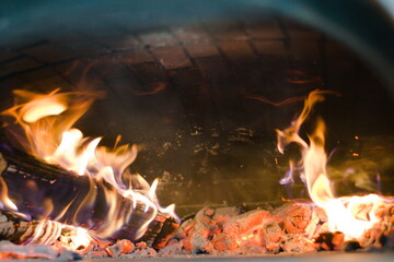 Roaring Flames and Glowing Embers in a Pizza Oven