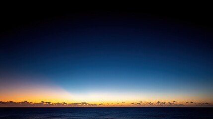 Fototapeta premium The beautiful sunset on the ocean horizon provides ample blank space for text or design, making it perfect for travel, vacation, or nature themes.