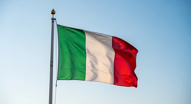 Italian flag waving in the wind against a clear blue sky. - Powered by Adobe
