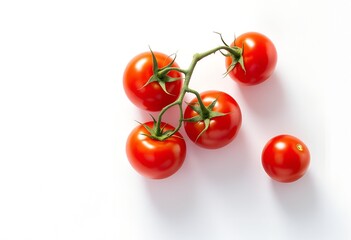 Overhead view of fresh red cherry tomatoes on a vine against a white background