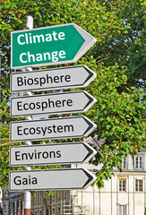 Naklejka premium A concept road sign pointing in the direction of 'Climate Change' with some descriptive words underneath