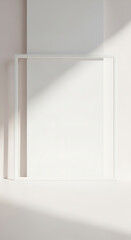 Empty White Frame Leaning Against Wall with Abstract Sunlight Shadows