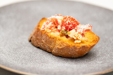Macro Shot of Fresh Baguette with Cheese, Tomato and Seasoning