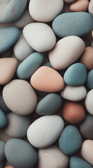 Colorful pebbles of different shapes and sizes creating a natural mosaic on a flat surface
