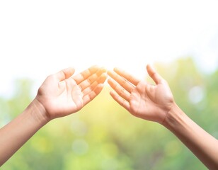 Two open hands reaching towards each other against a soft, blurred nature background