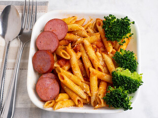 penne pasta with  sliced kielbasa