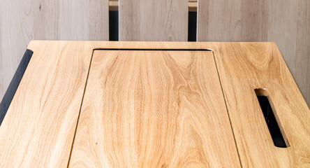 Mobile phone with wireless charger on table. Modern workplace accessory